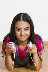 Image showing teenage girl playing video games 