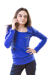 Image showing Teenage girl thinking for an answer on smartphone