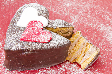 Image showing Heart shaped slice of a chocolate-cake