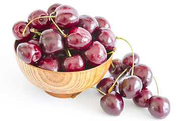 Image showing Fresh Cherries in a wooden bowl