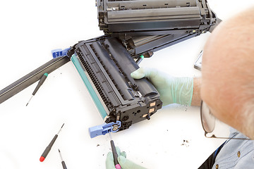 Image showing adult man working toner cartridge