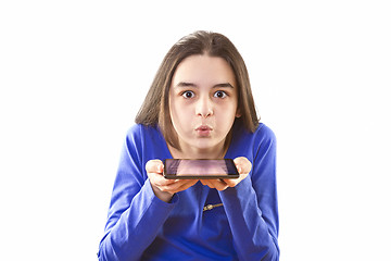Image showing Teenage girl blowing app icons from digital tablet