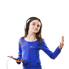 Image showing Smiling girl listening to music