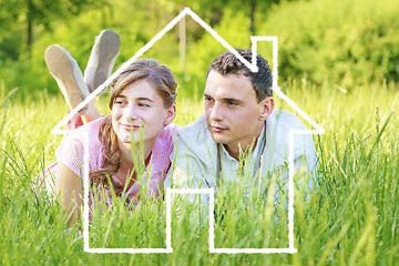 Image showing Young couple dreaming to a house