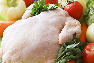 Image showing whole raw chicken with vegetables