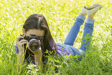 Image showing Young girl taking photos 