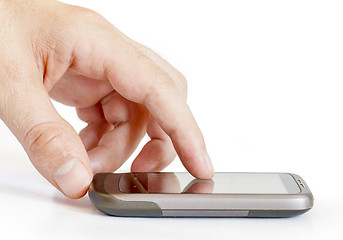Image showing Finger touching smart phone
