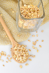 Image showing Oat-flakes with a wooden spoon