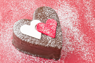 Image showing Heart shaped slice of a chocolate-cake