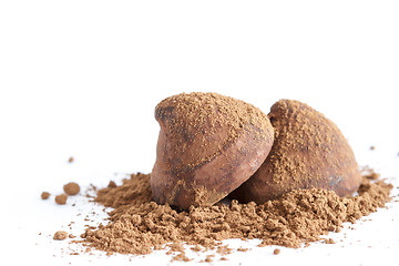 Image showing Chocolate truffles on cocoa powder