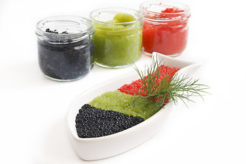 Image showing CAVIAR IN THE OPEN GLASS CONTAINERS