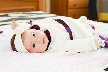 Image showing Newborn baby girl looking at camera