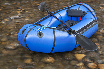 Image showing packraft with a paddle