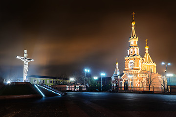 Image showing Statue of the crucifixion and church.