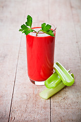 Image showing tomato juice in glass and green celery