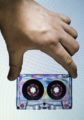 Image showing Hand holding vintage cassette tape