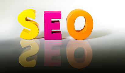 Image showing Multicolored word seo made of wood.