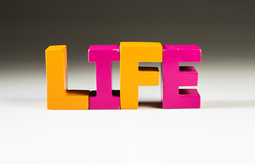 Image showing Multicolored word life made of wood.