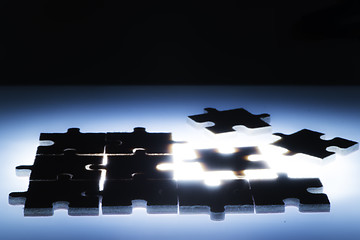 Image showing Wooden puzzle and backlight background