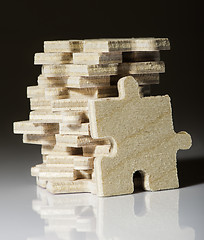 Image showing Wooden puzzle on white background. 