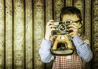 Image showing Child taking pictures with vintage camera