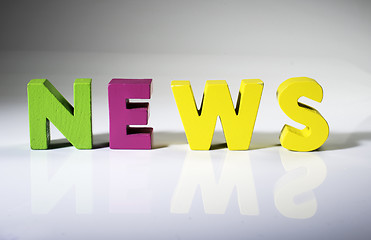 Image showing Multicolored word news made of wood.