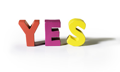 Image showing Multicolored word yes made of wood.