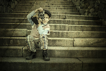 Image showing Child with vintage camera