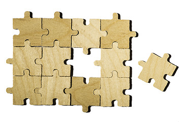 Image showing Wooden puzzle on white background. 