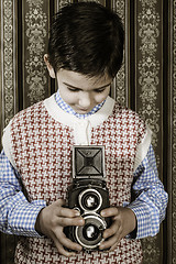 Image showing Child taking pictures with vintage camera