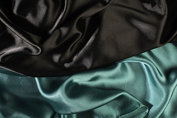 Image showing Shiny black and green satin fabric