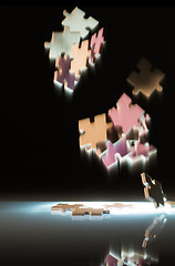Image showing Falling puzzle pieces.
