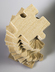 Image showing Wooden puzzle on white background. 