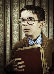 Image showing Child with red vintage book