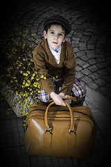 Image showing Child on a road with vintage bag