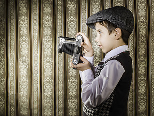 Image showing Child taking pictures with vintage camera