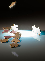 Image showing Falling puzzle pieces.