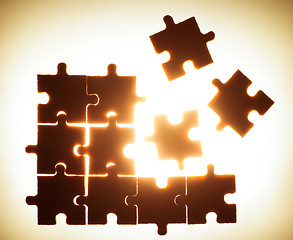 Image showing Wooden puzzle and backlight background