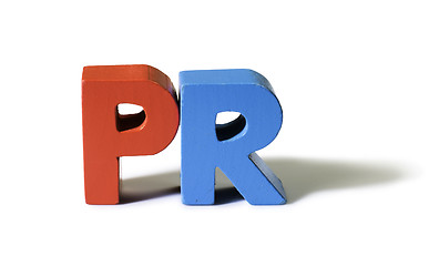 Image showing Multicolored word PR made of wood.