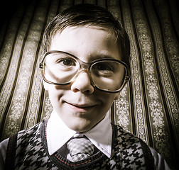 Image showing Smiling child with glasses in vintage clothes