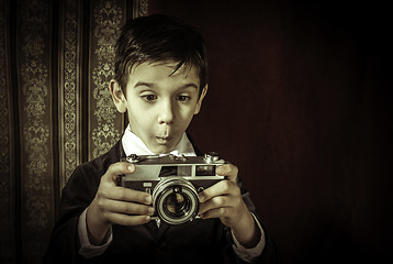 Image showing Child taking pictures with vintage camera