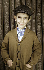 Image showing Smiling child in vintage clothes and hat