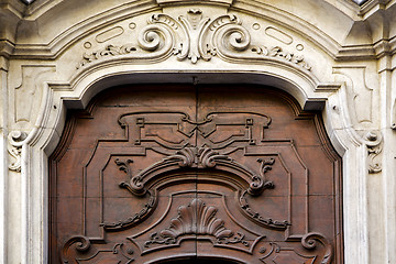 Image showing abstract   brass   in a   closed wood door    lugano Switzerland