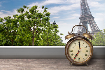 Image showing View of Paris and Eiffel tower from window with alarm clock