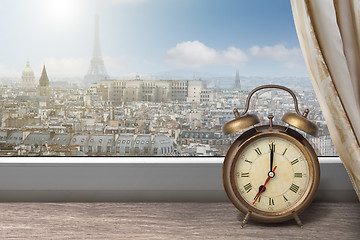 Image showing View of Paris and Eiffel tower from window with alarm clock