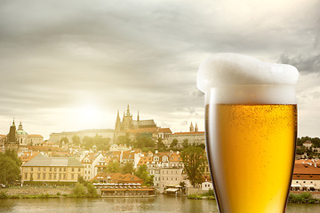 Image showing Glass of beer against view of the St. Vitus Cathedral in Prague