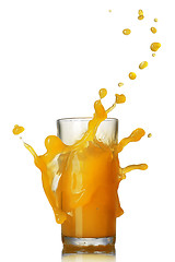 Image showing orange juice splash in the glass isolated on white