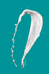 Image showing milk splash isolated on blue background