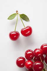 Image showing Red cherry with leaves on white