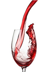 Image showing Splash of wine in glass isolated on white